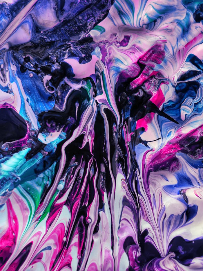Dynamic abstract acrylic painting with vibrant colors and fluid patterns.