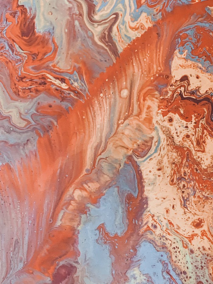 Dynamic and colorful fluid acrylic art with delicate textures and lively hues.